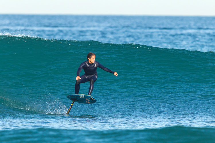 kai lenny foil surfing on a wave